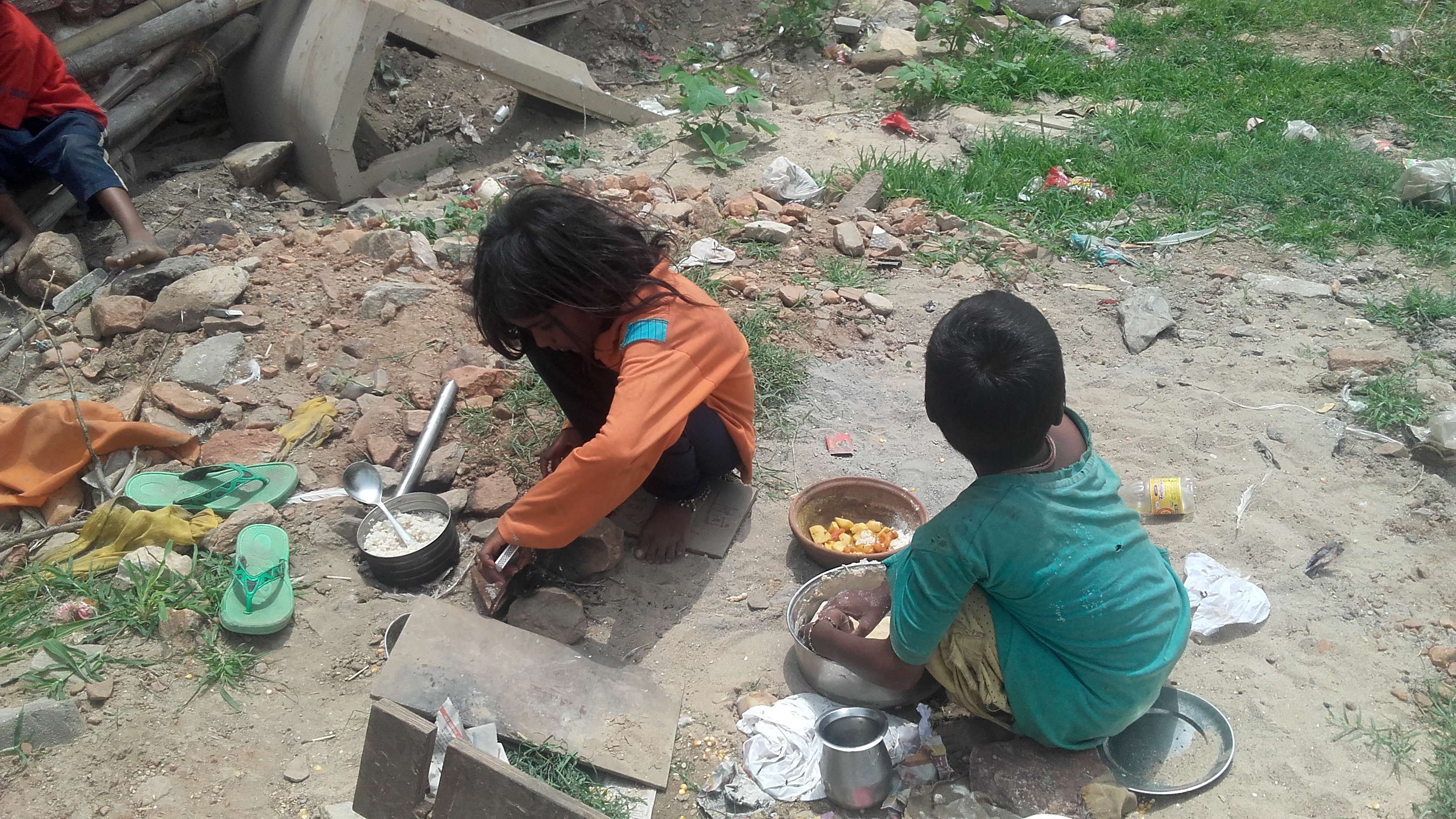 innocent poor girls making mid day meal for family