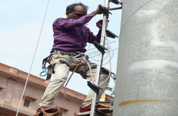man climbed over mobile tower