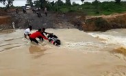 Scooty blown in river