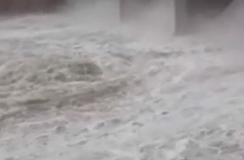 man washes in river