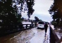 Water flowing over the bridge