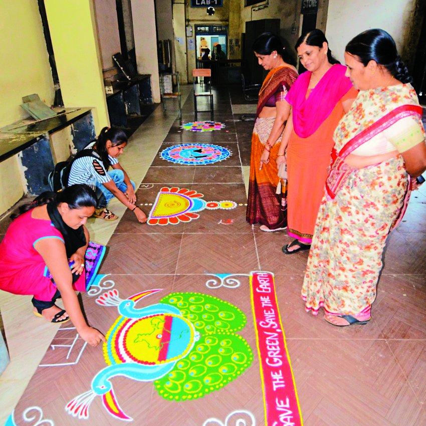 Young festive splendor singing and scattered colors in Rangoli