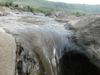 The dam is stopping the stream of river Mundon