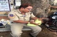 viral photo of telangana police constable playing with baby