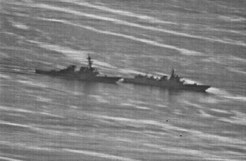 Chinese warship chasing American ship