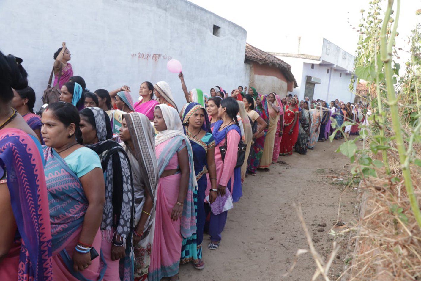 Rally brought together women with turmeric, rice, invitations to vote, Gagan piercing slogans