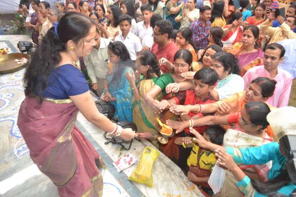 People of Bengali society worshiping Durga Ashtami in indoor stadium