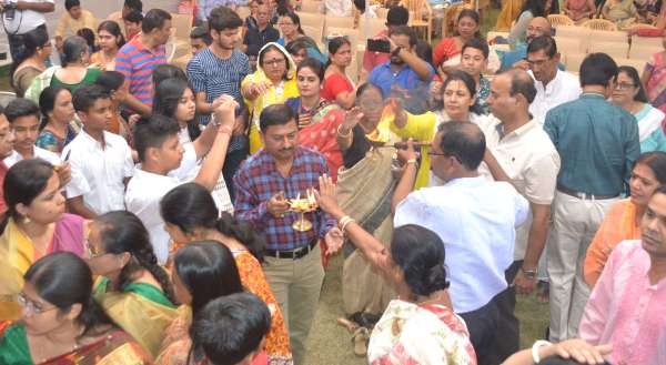 People of Bengali society worshiping Durga Ashtami in indoor stadium