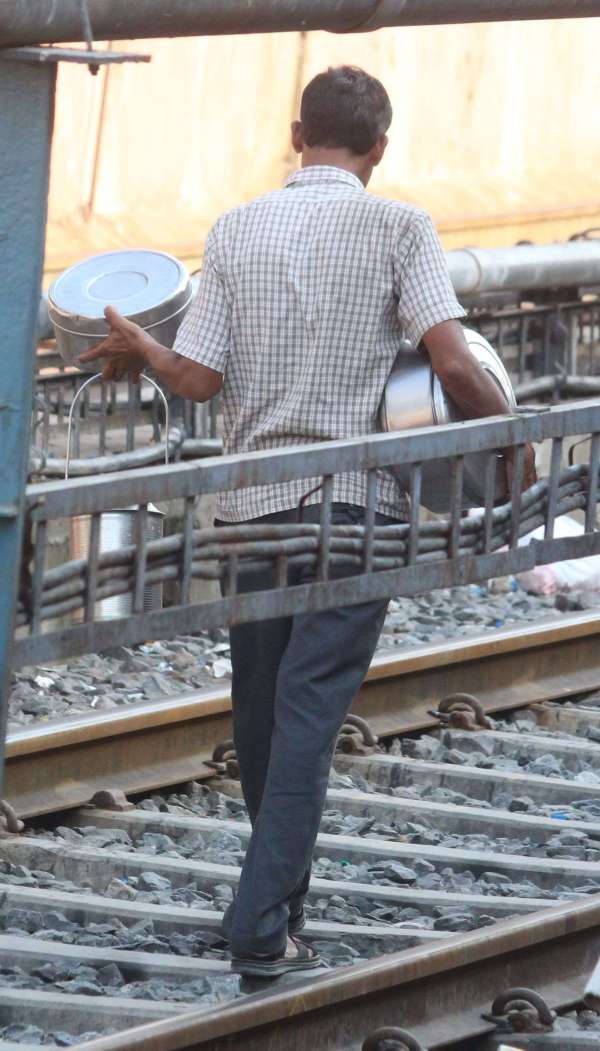 People crossing the tracks carelessly