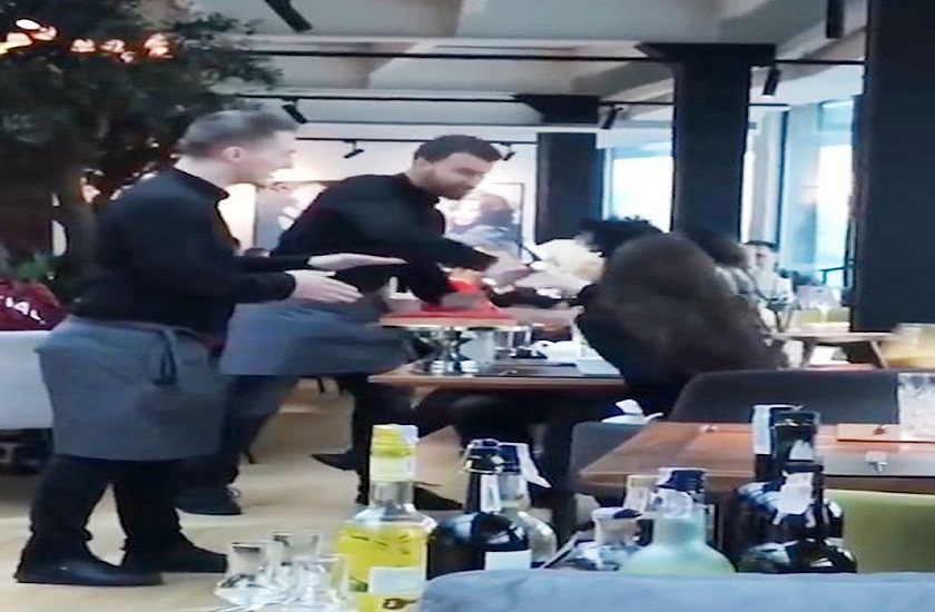 waiters slam cake into rude diner face