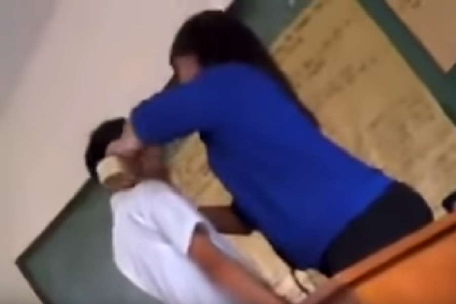 Shocking moment school teacher tape small Childs mouth shut