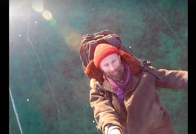 man walking across the world deepest frozen lake baikal
