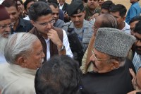 Two Congress leaders in front of the pilot