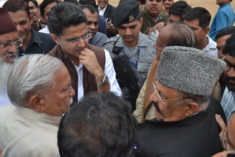 Two Congress leaders in front of the pilot