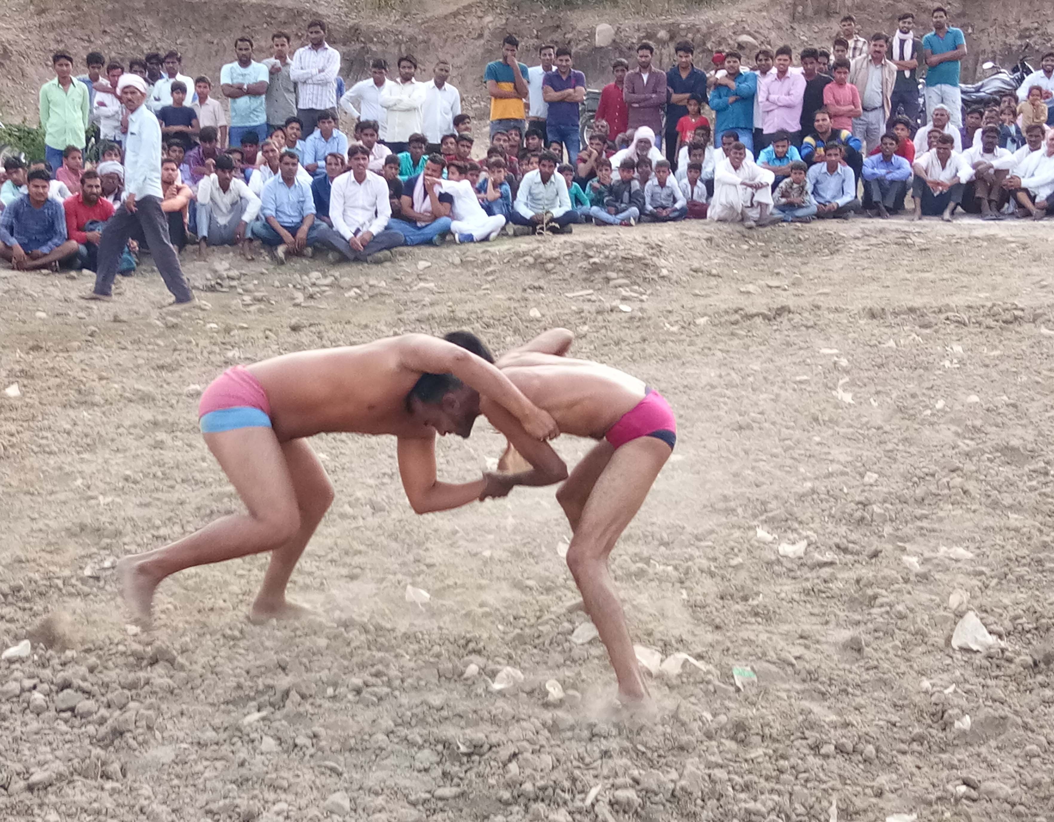 Wrestlers in the arena show the stamina
