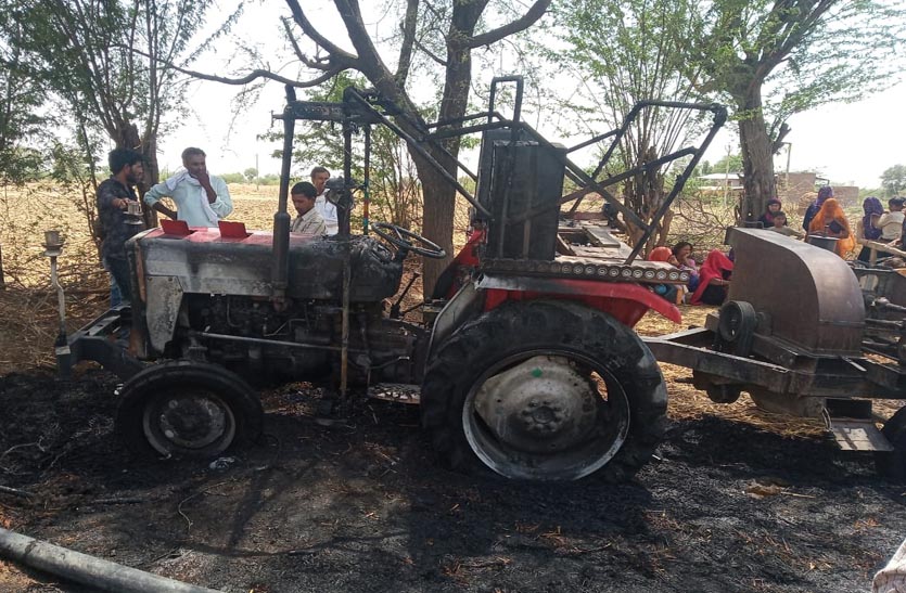 tractor-standing-in-the-enclosure-caught-fire