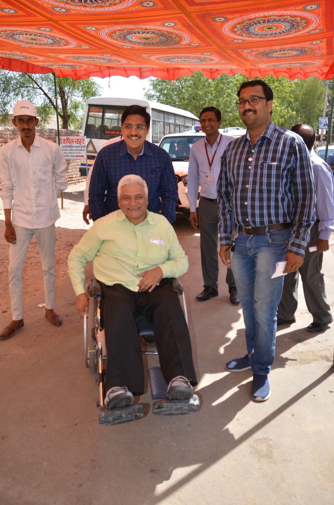 When the District Electoral Officer drove the voter's wheel chair hims