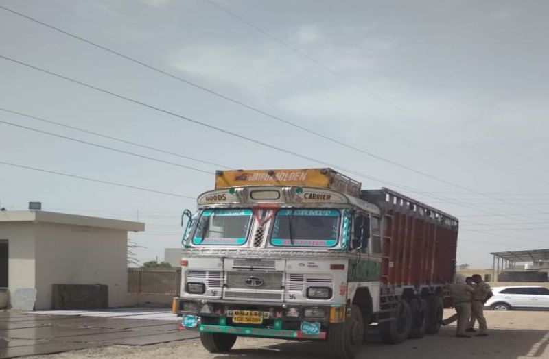 Four people sitting in the truck