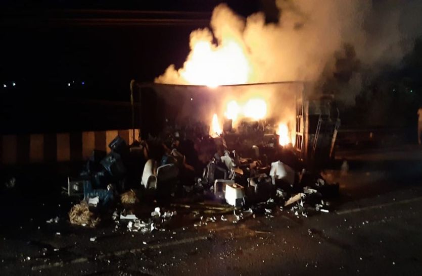 Fire in truck overturned after tire burst