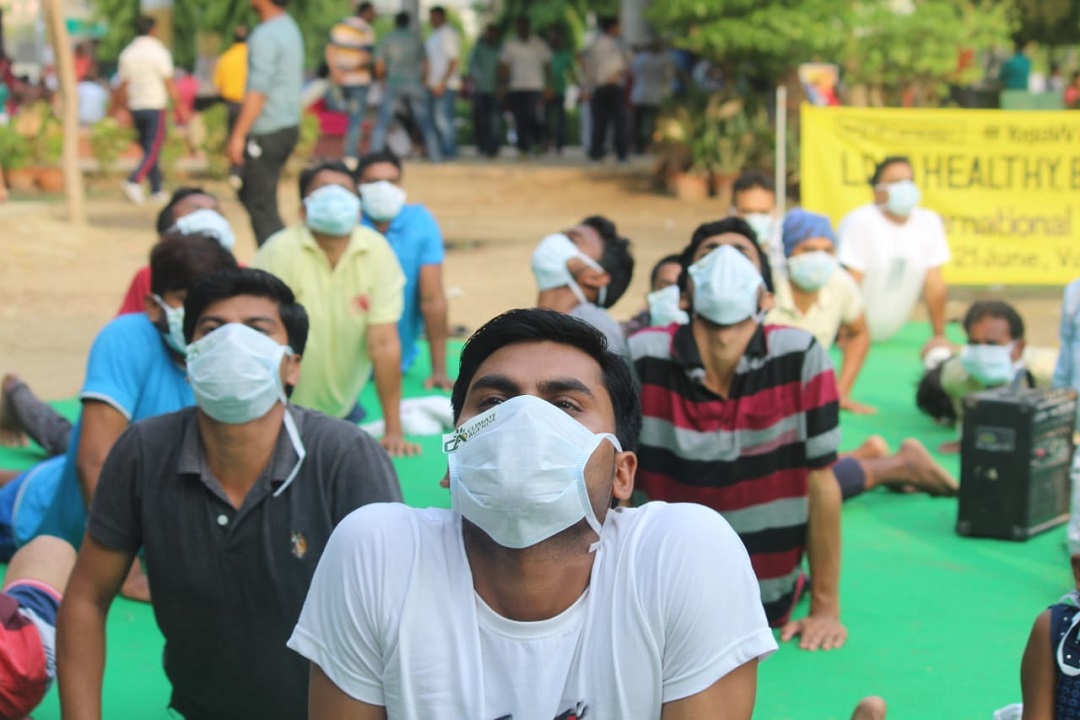 Yoga with mask against air pollution on International Yoga Day