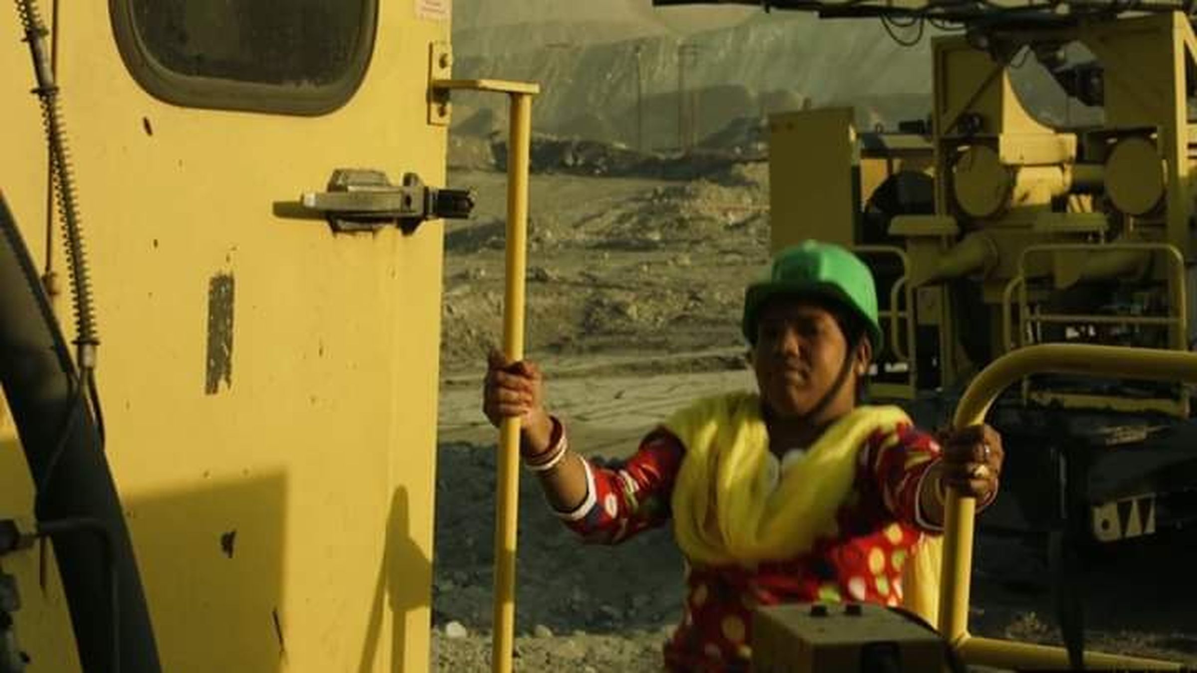 Women employees operating drill machine in the coal mine