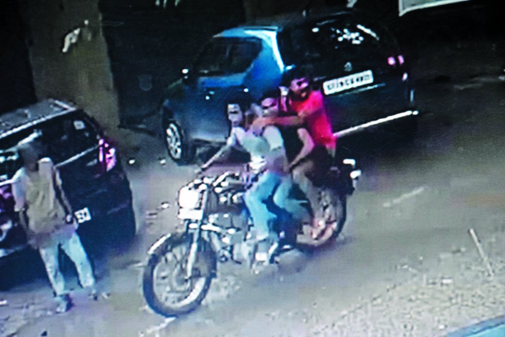bike riders target shooter on Two youths in satna