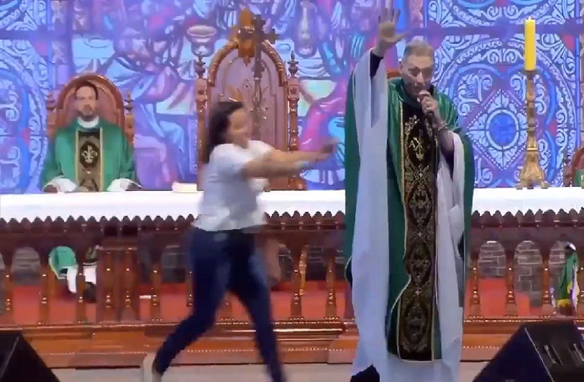 priest said fat women don't go to heaven woman shoves him off stage