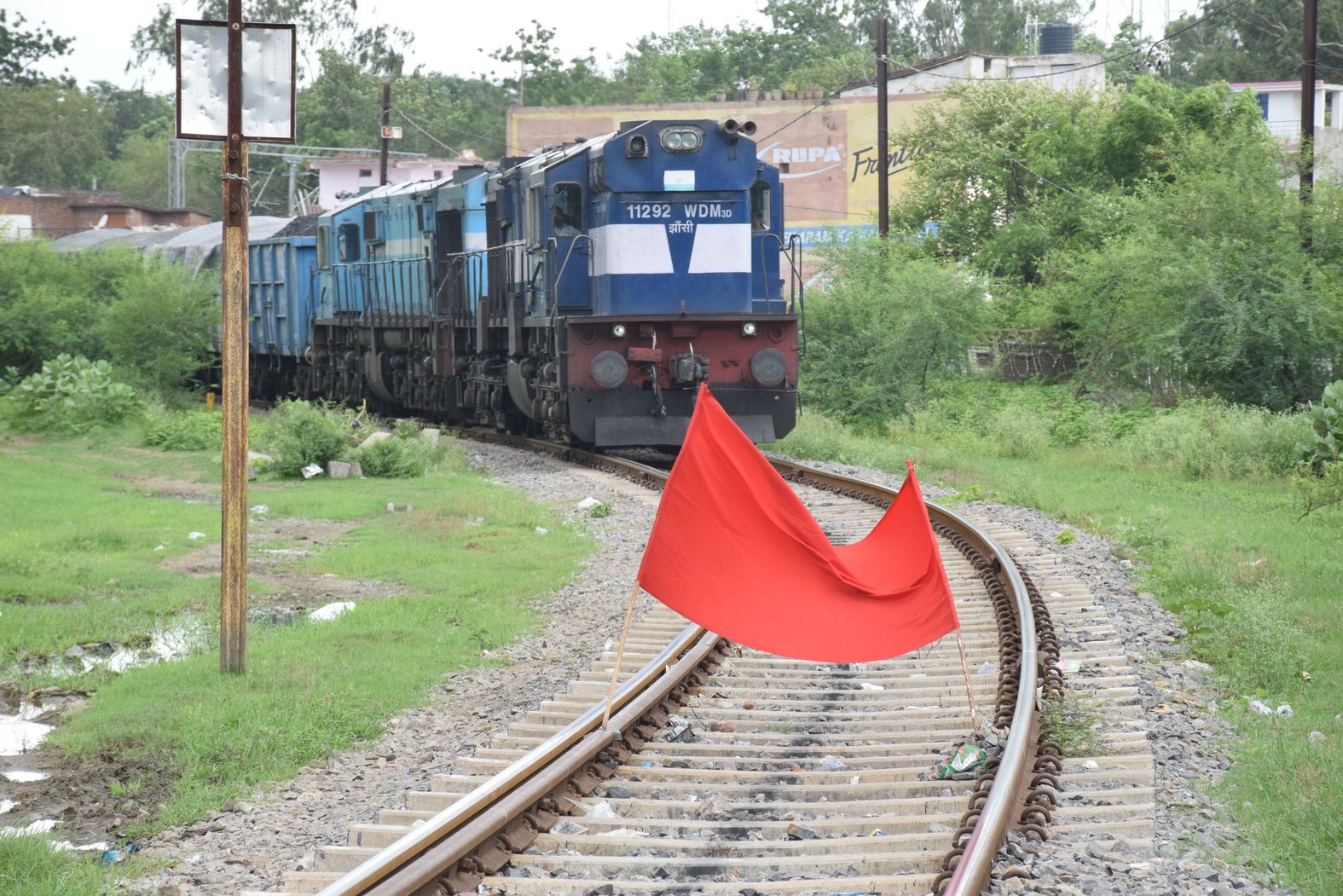 The goods train stopped after seeing the red flag, the officer ran