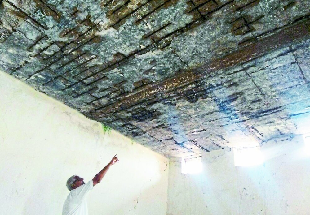 Water dripping from the school's shabby roof, responsible silence
