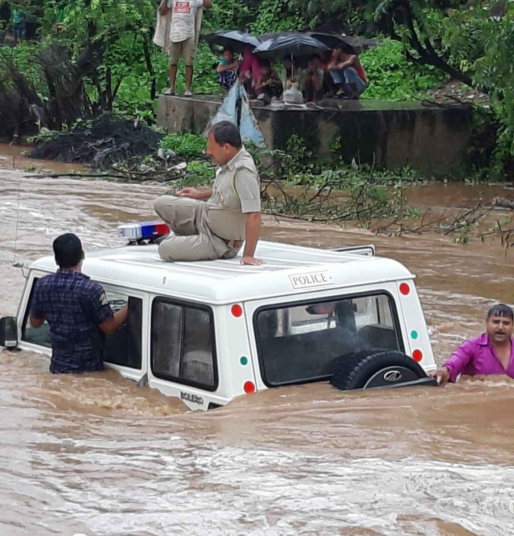 Police Bolero stuck in Heavy rains water