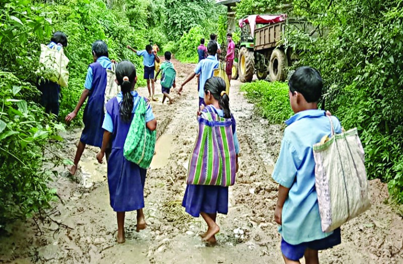 Children are going to school through mud drenching roads
