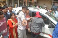 Husband, wife and she appeared on the road between