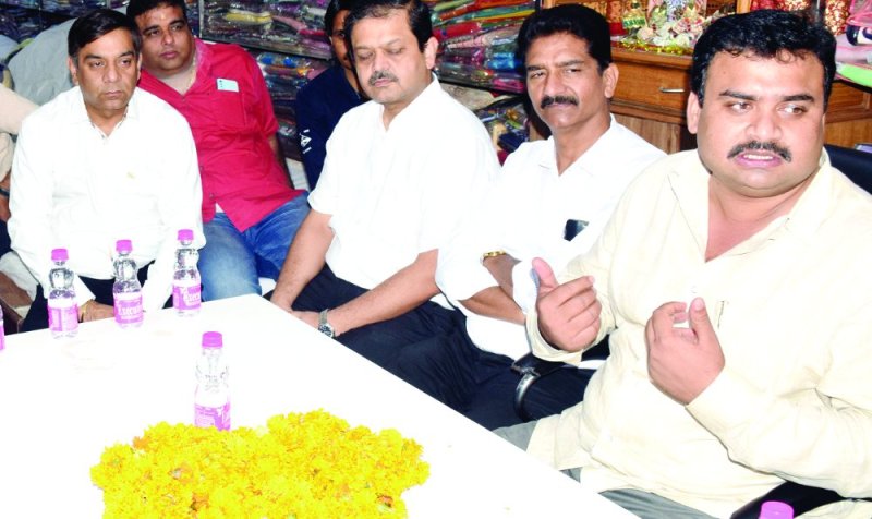 Businessman upset by dusty road in satna