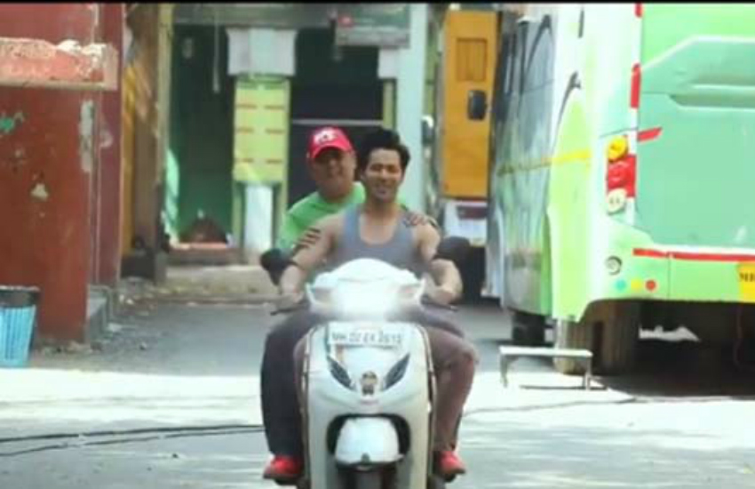 varun_dhawan_rode_a_scooter_without_helmet.jpg