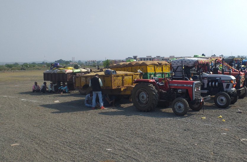 Dussehra ground filled with paddy tractor-trolleys