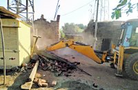 Bulldozers run for road widening, police deployed