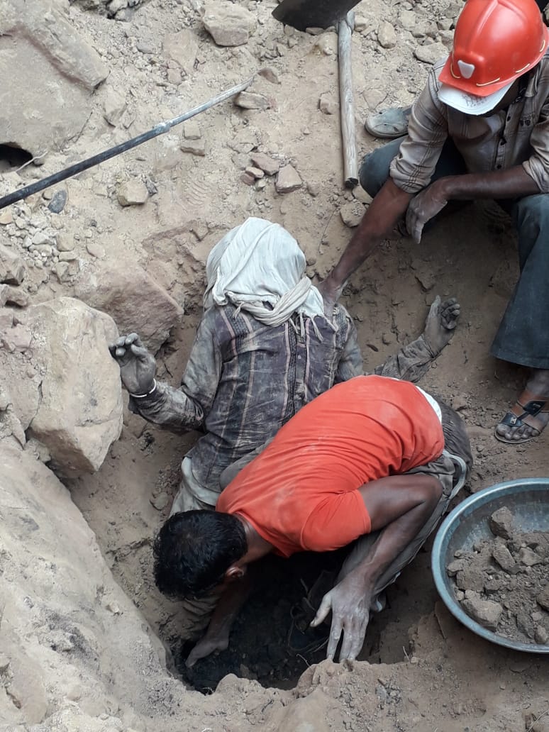 Villagers and family removed the dead body of another laborer from the