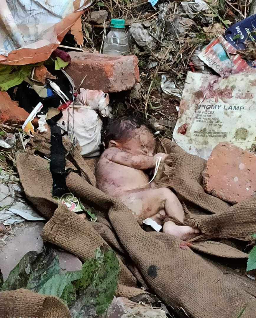 A newborn was thrown in a pile of trash after killing