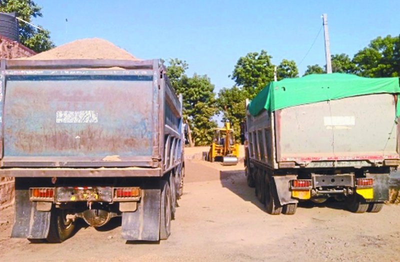Gravel-filled dumper and bulldozer seized