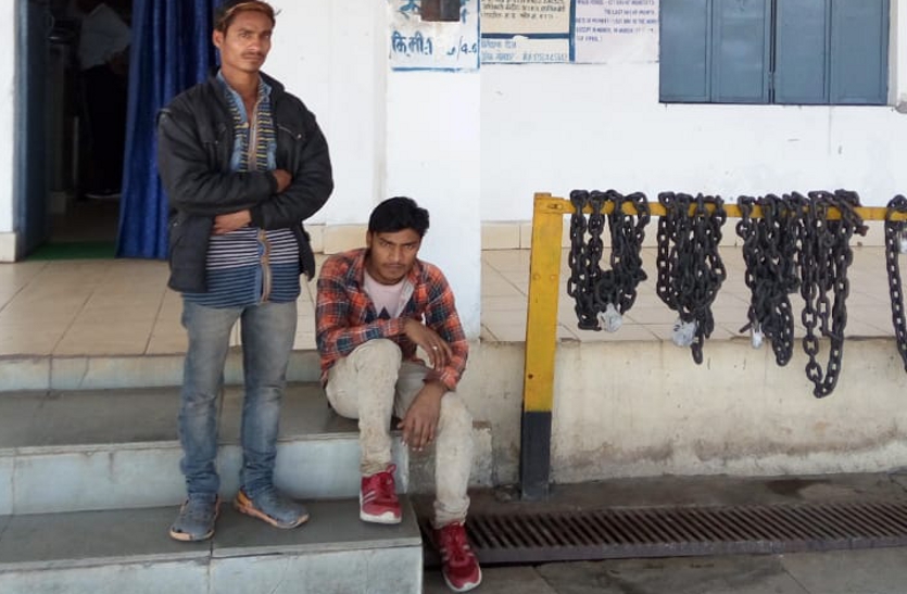 Youth and companion of mentally ill Jharkhand sitting outside Rupund station.