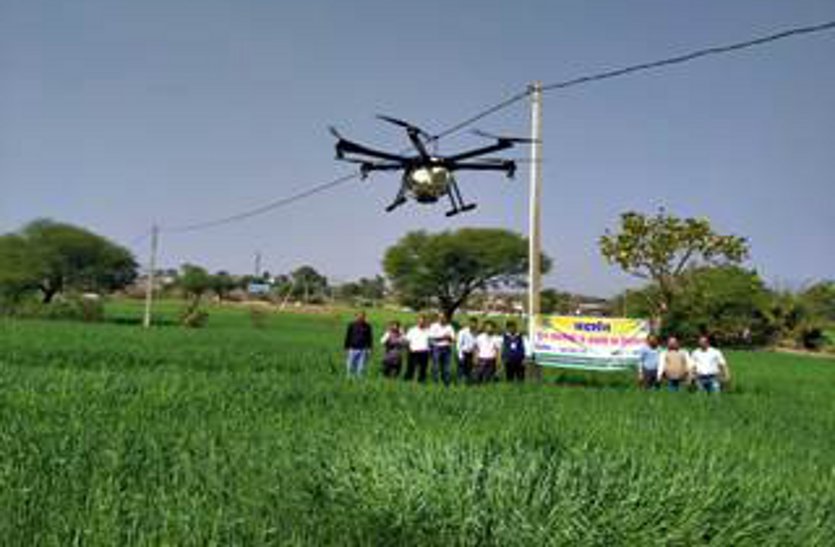 Farmers adopting new technology to spray crops with drones
