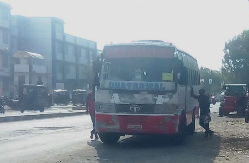 Private buses stand in front of bus stand