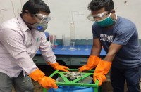 Members of technical team making sanitizer at OFK.