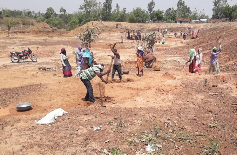Workers doing pond deepening work.