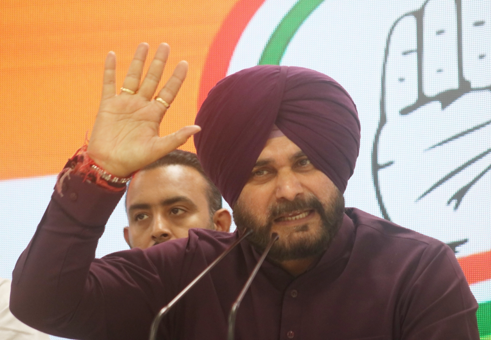 Sidhu publicly apologized for wearing shawl bearing a religious symbol