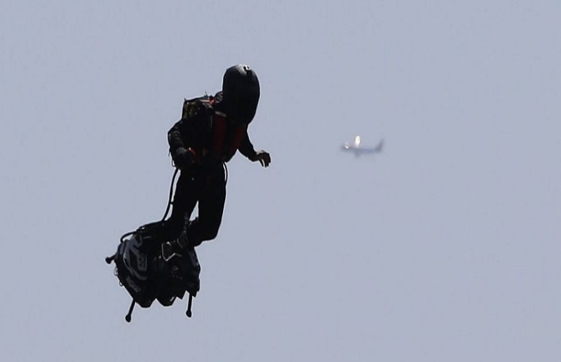 jetpack man flying in air