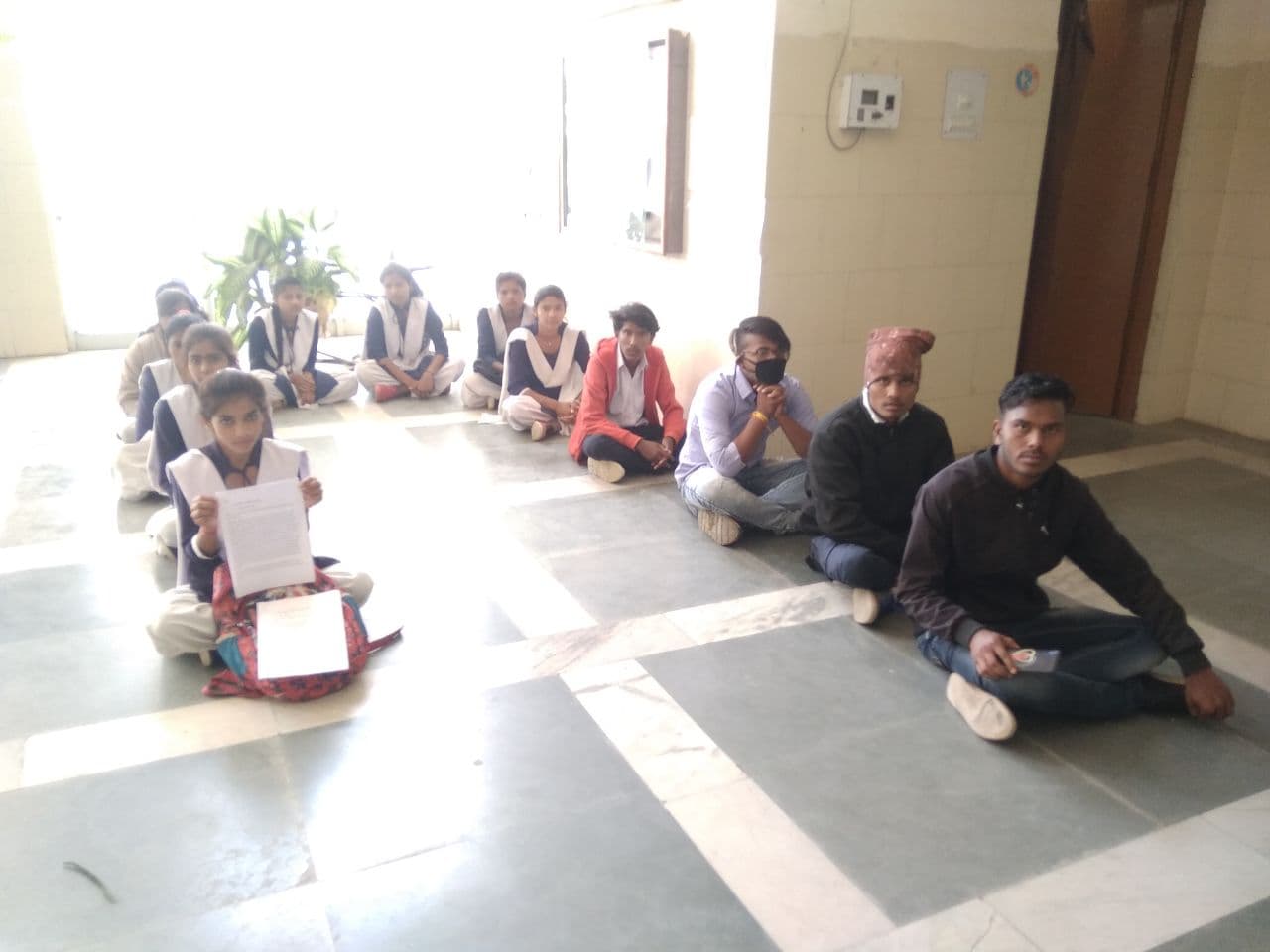 Examination center 15 km away, angry students sit on collectorate vera