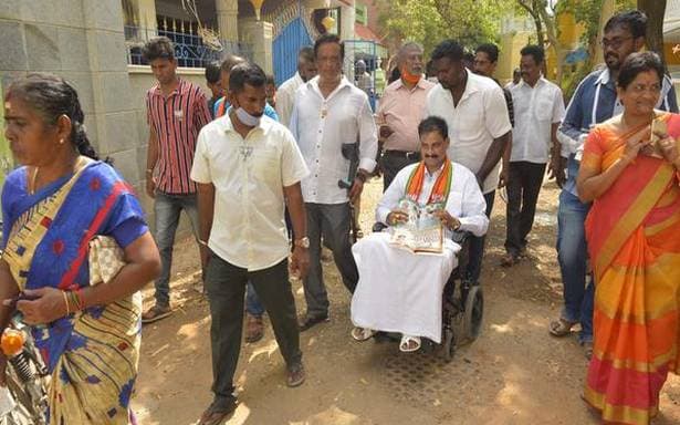 Puducherry Assembly Election 2021 BJP candidate campaign on wheelchair