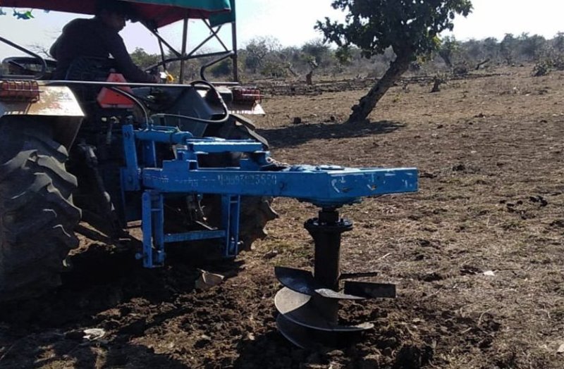 Tractor work being done in place of laborers