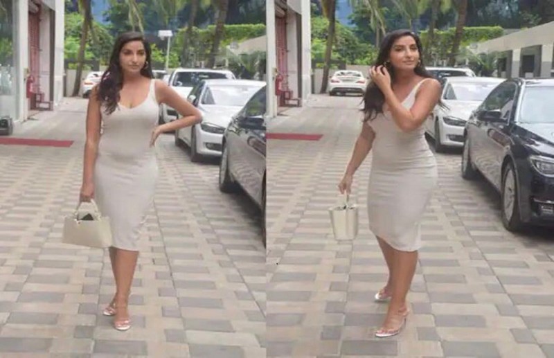 Nora Fatehi spot in beige bodycon dress with a mini handbag